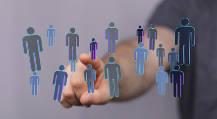 Hand touching digital people icons, symbolizing connection, teamwork, community, and social networking concepts
