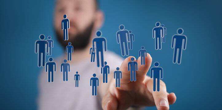 A person interacting with a digital interface of connected humans representing teamwork, communication, and col