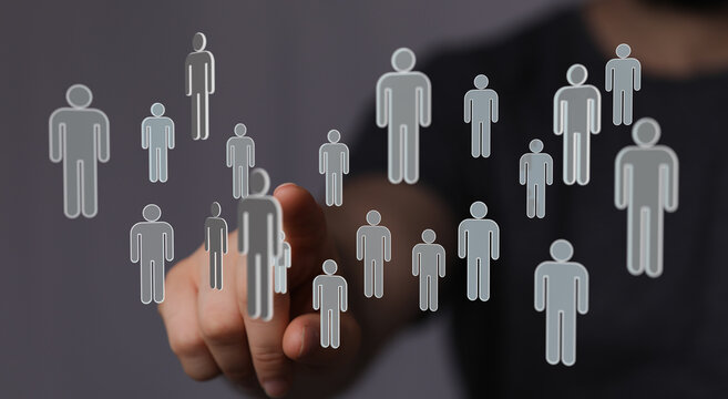 Hand touching digital human icons representing connection, teamwork, networking, technology, social media, and