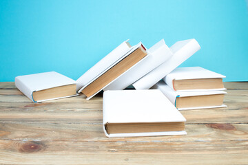 open book, books on the blue background. Back to school. Education. Copy space for text.