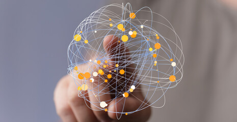 Hand touching a sphere of connected dots and lines representing globalization and the digital world with data connections and technol