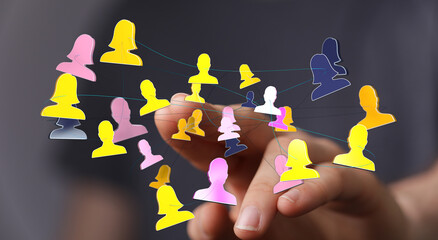 Visual representation of teamwork, connections, and networking through a hand interacting with linked figures symbolizing communication and digi
