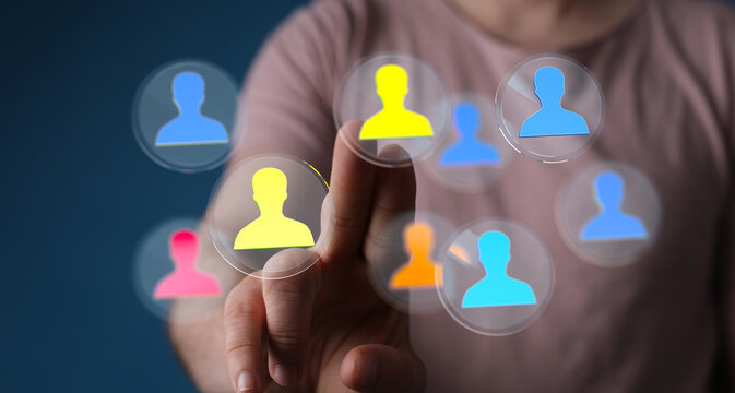 Hand selecting a person from a group, concept for recruitment, talent acquisition or teamwork. Human resources and business concept. - Powered by Adobe