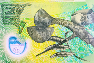 2 Kina Papua New Guinea with the image of Mount Hagen axe, Kula arm band from the Milne Bay Province, engraved dog's teeth from the Bougainville are. Polymer money Papua New Guinea.