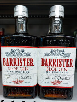Sloe gin bottles sit on a store shelf showcasing their elegant design and limited edition label with a vintage aesthetic