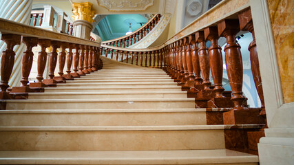 Naklejka premium bottom view of the columns and stairs of the building classic interior design