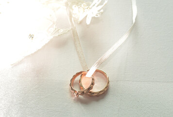 Elegant precious Diamond wedding Rings Resting On Surface With Blurred Backdrop For Wedding ceremony