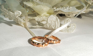 Elegant precious Diamond wedding Rings Resting On Surface With Blurred Backdrop For Wedding ceremony