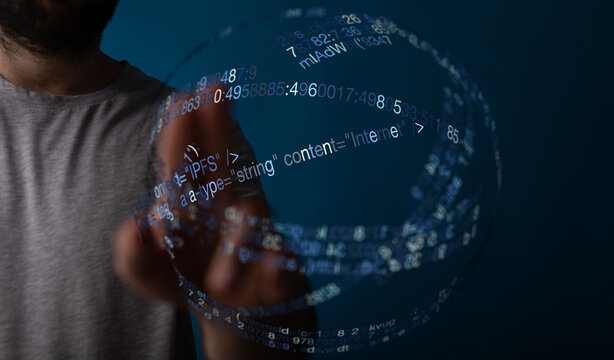 Abstract shot of a hand interacting with digital data streams forming a sphere. Concept of the internet, information technology, and