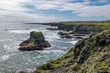 Obraz premium Arnarstapi basalt rocks in atlantic ocean in Iceland
