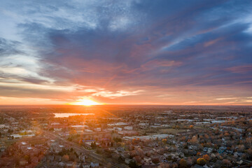 sunrise over midtown of Fort Collins and plains in northern Colorado, November aerial view