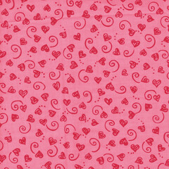 Seamless hand-drawn hearts and swirls doodle pattern in red on pink; cute Valentine background for fabric, wrapping paper, stationery, kids decor, and romantic designs.