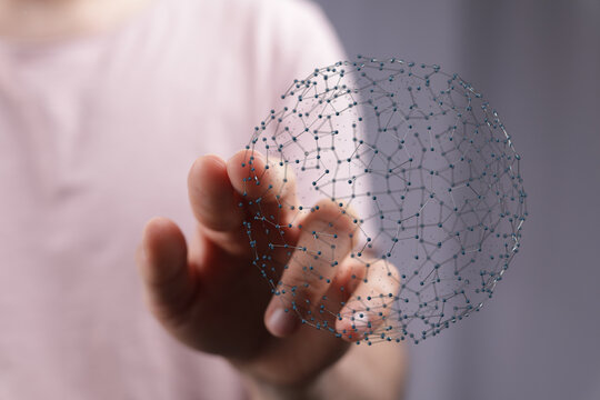 Hand reaching out to touch a 3D digital network globe symbolizing connectivity, innovation and communication. Ideal for technology and business