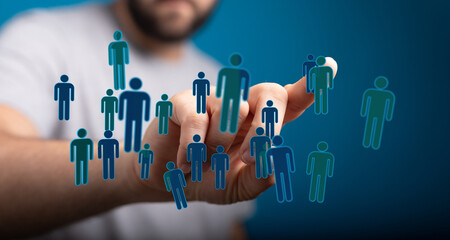 Hand reaching towards network of people icons, symbolizing teamwork, connectivity, and digital transformation.