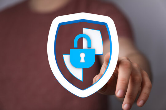 Person interacting with a digital shield icon representing data protection, cyber security, and network safety. Symbol of privacy and