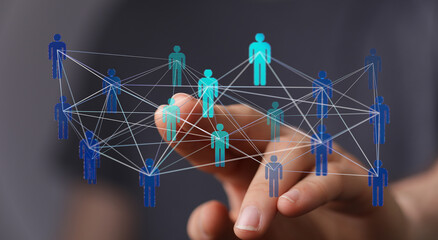 Abstract image showing network of connections with digital person icons pointing towards hand. Concept for business networking, technology and c