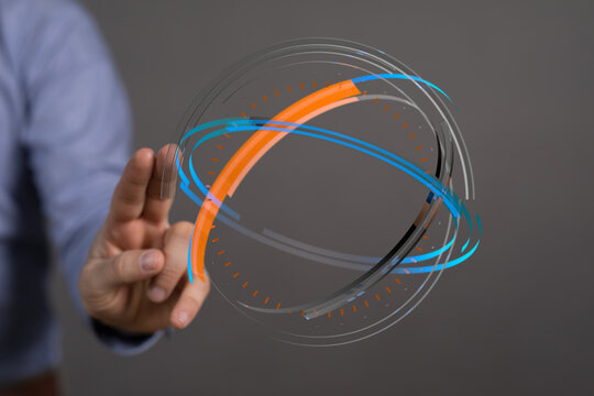 Abstract graphic of a human hand interacting with a glowing digital sphere. Concept of technology, connection, and data visualization