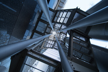 Abstract Upward View of Modern Steel Fire Escape and Grated Exterior Staircase