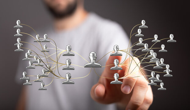 Business man is connecting with a virtual network representing people, connection, teamwork, communication, and digital technology.