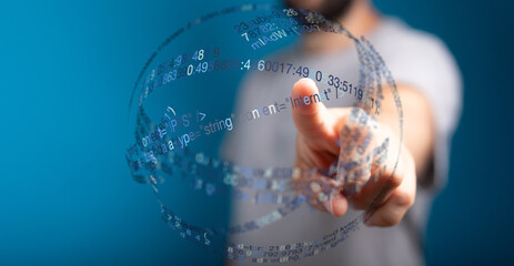 A person's finger pointing towards a digital sphere composed of code and data. A concept of technology, innovation, and futuristic in
