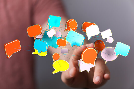 Visualize communication. Hand touches message bubbles. Connection concept of social media, internet, and networ