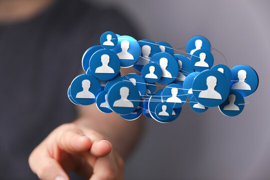 Abstract business concept of a digital network with people icons held in a hand. Illustrating connection, community, and social media engagement