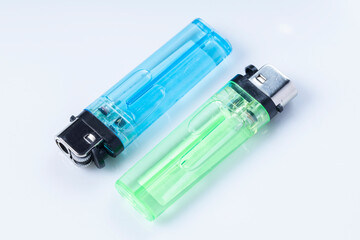 Two Colorful Disposable Lighters With Translucent Plastic Bodies