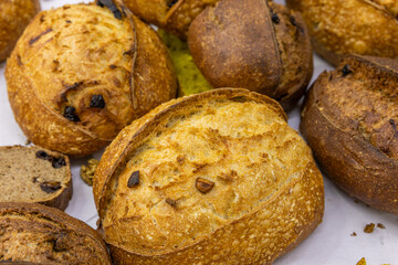 Fresh bread from the oven at a small artisan bakery at home. Very healthy sourdough bread products of various types. 