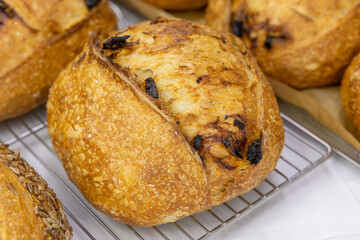 Fresh bread from the oven at a small artisan bakery at home. Very healthy sourdough bread products of various types. 
