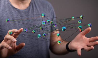 Person holding a 3D network model with connections, representing technology and connections, networking concept