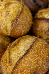 Fresh bread from the oven at a small artisan bakery at home. Very healthy sourdough bread products of various types. 