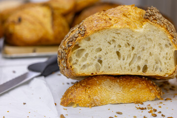Fresh bread from the oven at a small artisan bakery at home. Very healthy sourdough bread products of various types. 