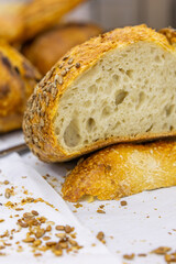 Fresh bread from the oven at a small artisan bakery at home. Very healthy sourdough bread products of various types. 