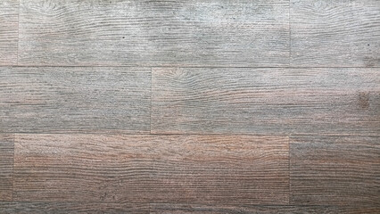 Texture of light brown wooden surface with a simple horizontal line pattern.
