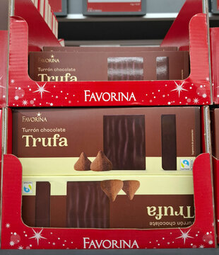 DENIA, SPAIN - November 15, 2025.Christmas sweet turron made with chocolate displayed on supermarket shelves in Spain during the holiday season