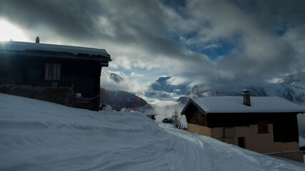 cottages in the village of rosswald during winter, switzerland