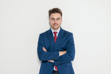 Smiling attractive man posing with arms crossed