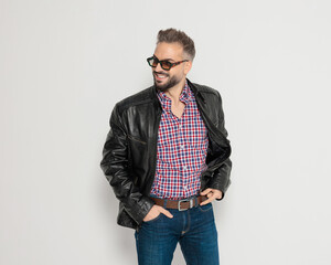 Happy casual man smiling and looking to the side