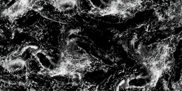 Aerial view. Black and white. Waves breaking against the rocks. Maelstrom, natural phenomenon of whirlpool, 