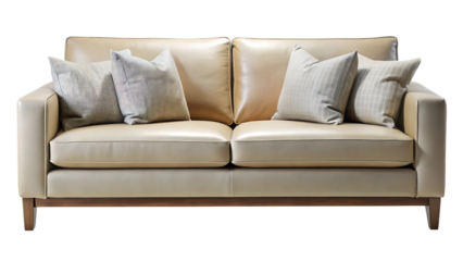 A luxurious and comfortable creamcolored leather sofa with decorative throw pillows, isolated on a transparent background, perfect for interior design and home decor