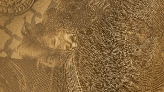 Detailed golden engraving texture with a macro view of a classic portrait. Ideal for finance, luxury, wealth visuals. High-impact cinematic clip, part of series.