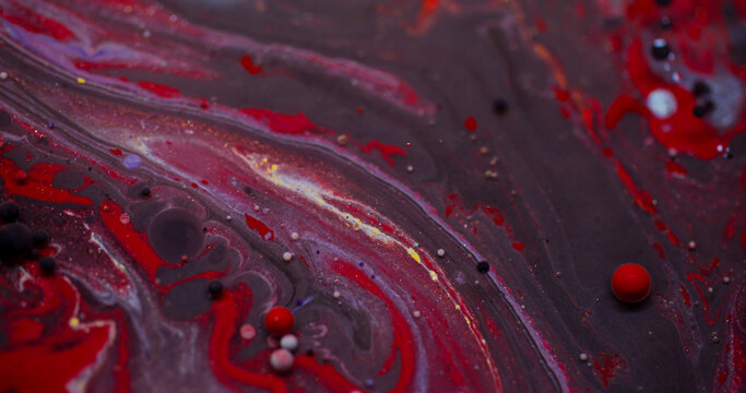 Ink water. Oil liquid. Blur red purple color dark black bubble glitter round acrylic flow splash floating on abstract art background.
