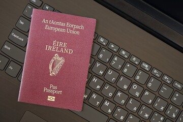 Ireland Passport Lies Black Laptop