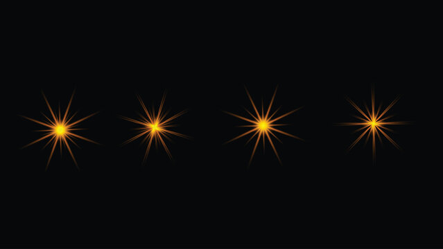 Four golden starburst light effect elements glowing brightly