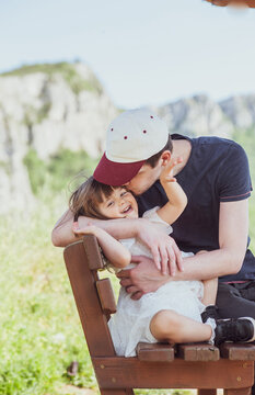 A father and a daughter are having a great time in nature

