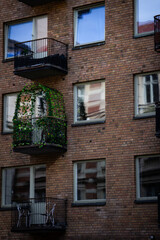 Close-Up Detail of a Modern Residential Building Facade with Small Balconies in Stockholm.