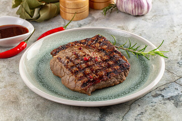Grilled juicy beef steak with pepper