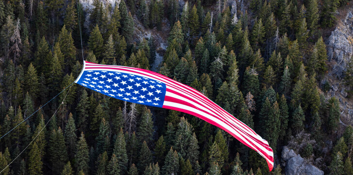 The Major Large American Flag Hanging in Mountains of North Ogden Utah Veterans Day - Powered by Adobe