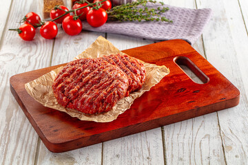 Raw uncoocked red beef round cutlet