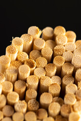 Thin round bamboo sticks are used as supports for indoor or other agricultural plants or for cooking, thin long sticks made of bamboo close up